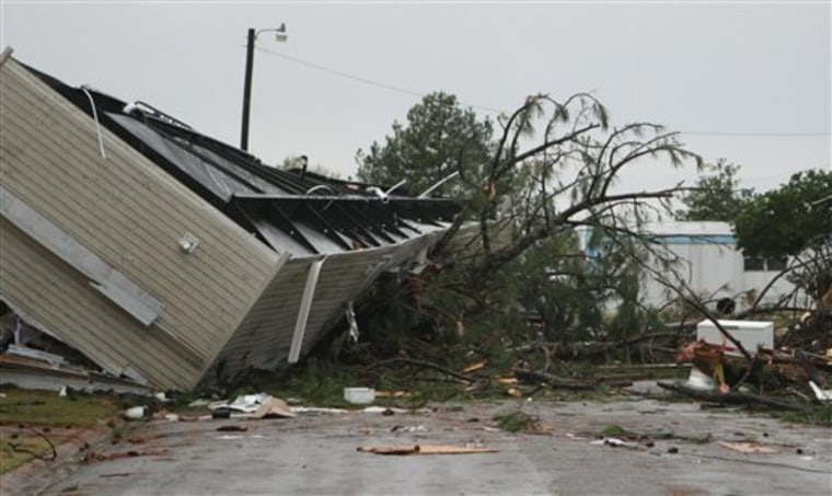 A mobile home is flipped over in the middle of the road at the The Pines mobile home park after severe weather came through Monday night in Starkville Miss.  Tuesday Nov.  30, 2010. (AP Photo/ Kerry Smith)